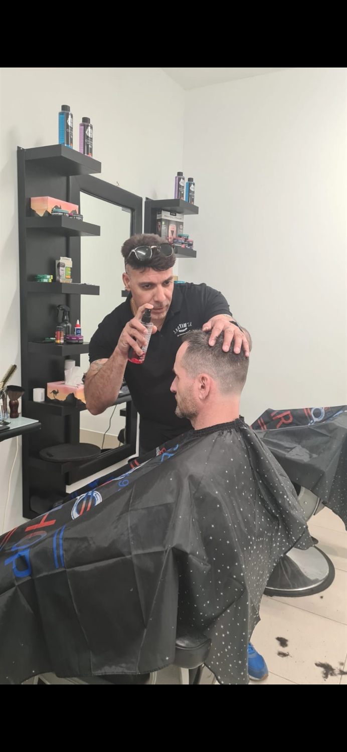 Client styled in the barber chair