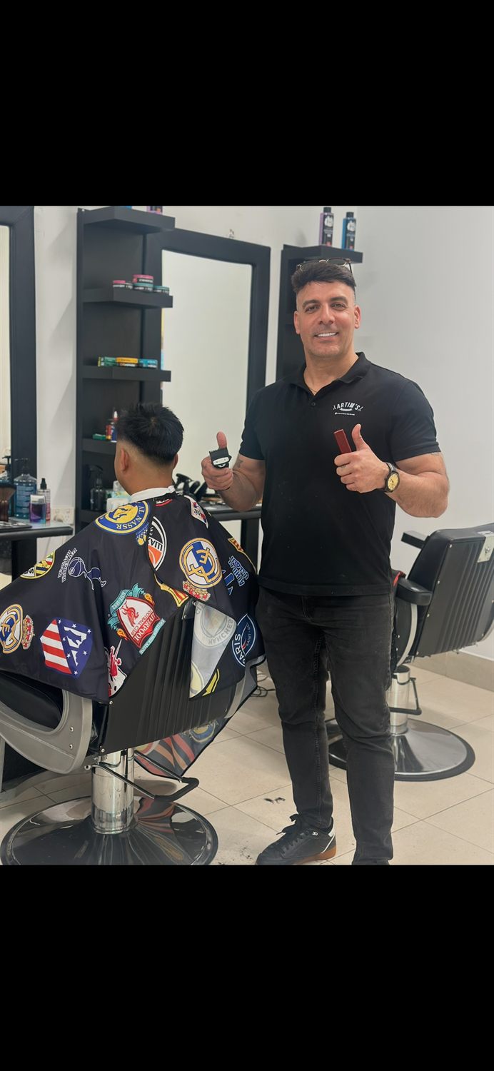 The Blend Boss barber giving a client a fresh cut in the shop